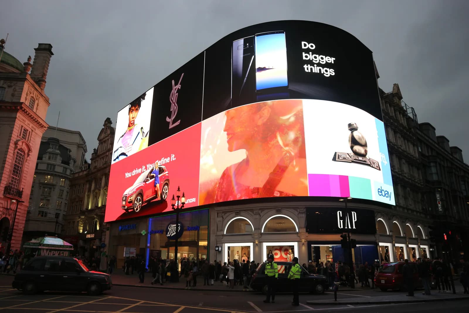 The curved Piccadilly Lights screen above Piccadilly Circus, London